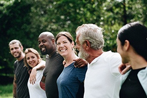Austin patient smiling with friends after gum disease treatment