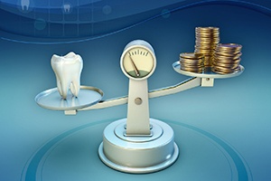 Coins and tooth on balance scale