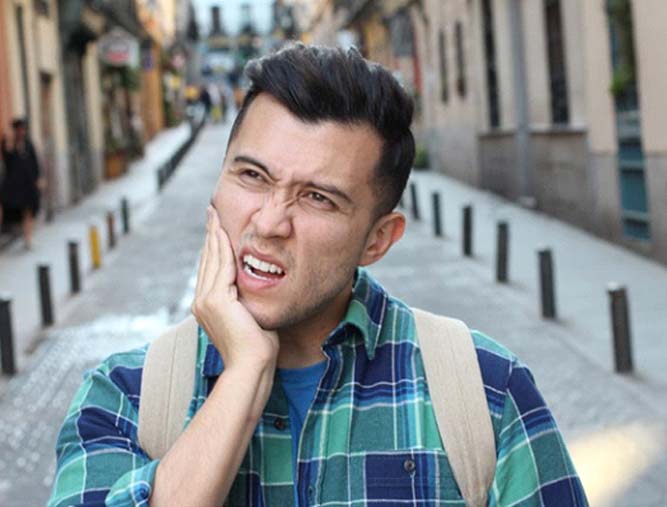 Man wondering if he should see his West Lake Hills emergency dentist