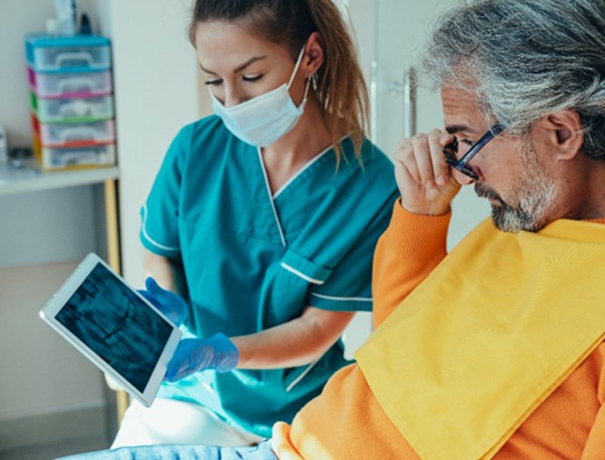 dental patient being shown an X-ray 