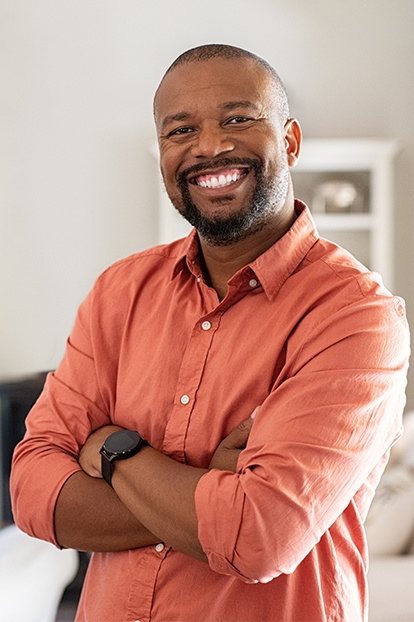 Man sharing healthy smile after periodontal disease treatment