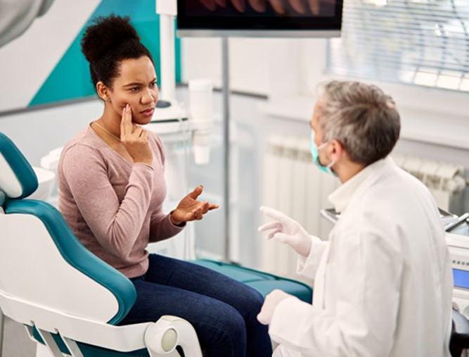 Woman having serious conversation with her dentist