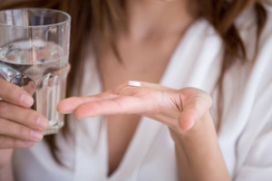 Lady prepares to take medication