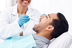 Man undergoing an oral cancer screening