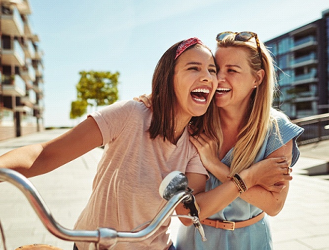 Group of friends smiling outside