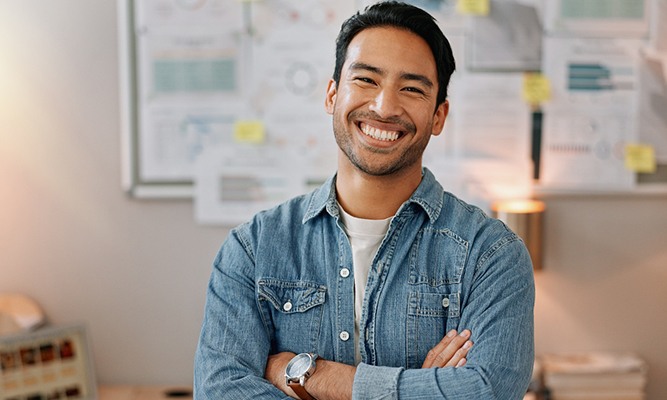 Male professional smiling at work
