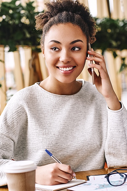 Woman with bright smile after Zoom teeth whitening