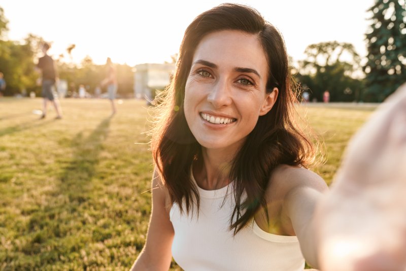 woman smiling after fluoride treatment in Austin