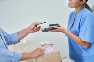 a patient paying their dental bill