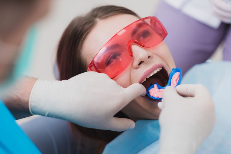 Woman getting fluoride treatment