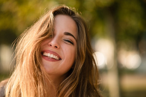 Close-up of woman with long hair smiling
