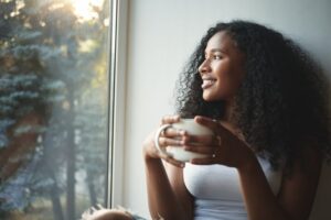 Woman enjoying a cup of coffee in the morning
